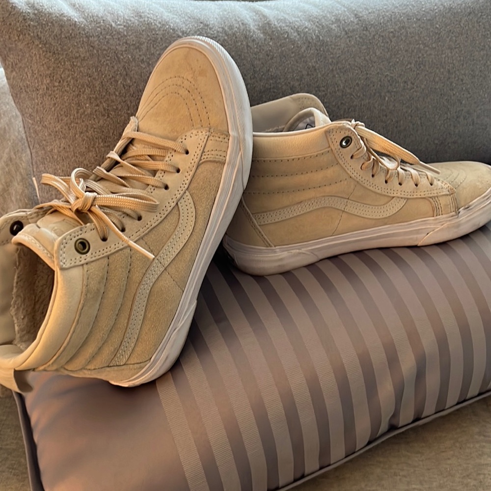 Tan suede high top Vans with fleece lined interior.